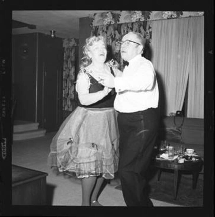 People dancing at a costume party.