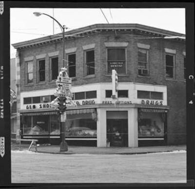 View of a corner drugstore (has Gem in the name).