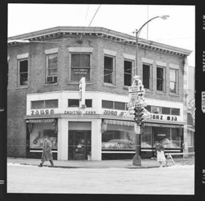 View of a corner drugstore (has Gem in the name).