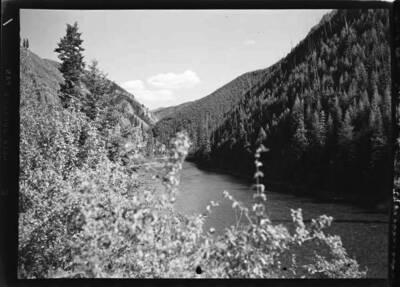 Image shows the St. Joe River winding through a tree lined canyon.