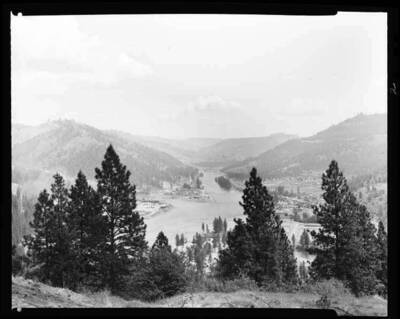 Image shows an unidentified town on a river.