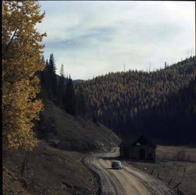 Image of car on dirt road.