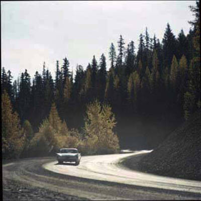 Image of car on dirt road.