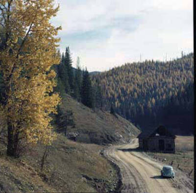 Image of car on dirt road.