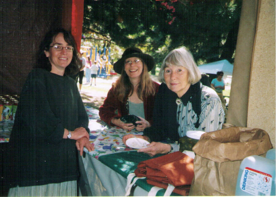 Moscow Civic Association booth at 2004 Ren Fair. Subjects appear as names read, lef to right: unknown; Palmer, Pam; Blackburn, Lois