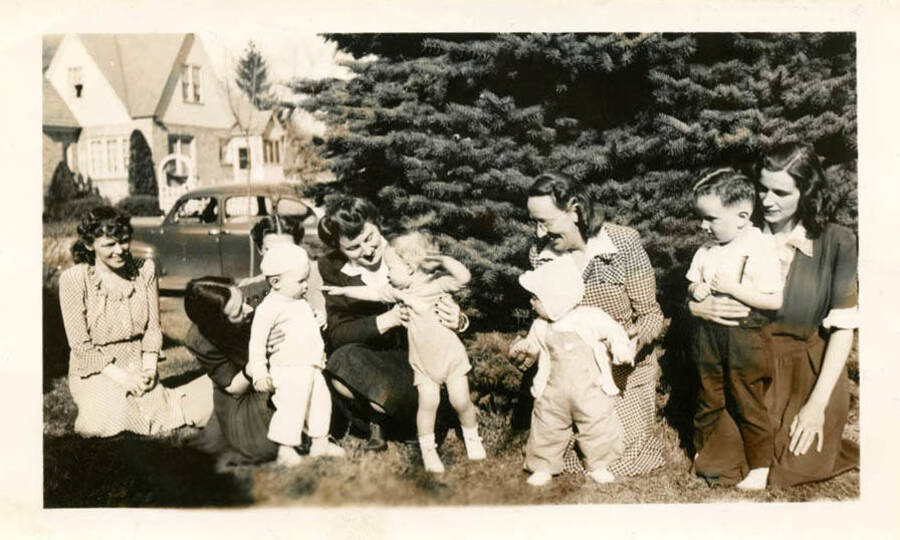 Sammy Bragdan's birthday party in the Fort Russell District in Moscow. Betty Bragdan, mother, also in picture. Left to right: unkown woman; Betty Bragdan and son Sammy; unknown woman; Marie Hopkins with son Bill; unknown woman and child. Possibly pictured: