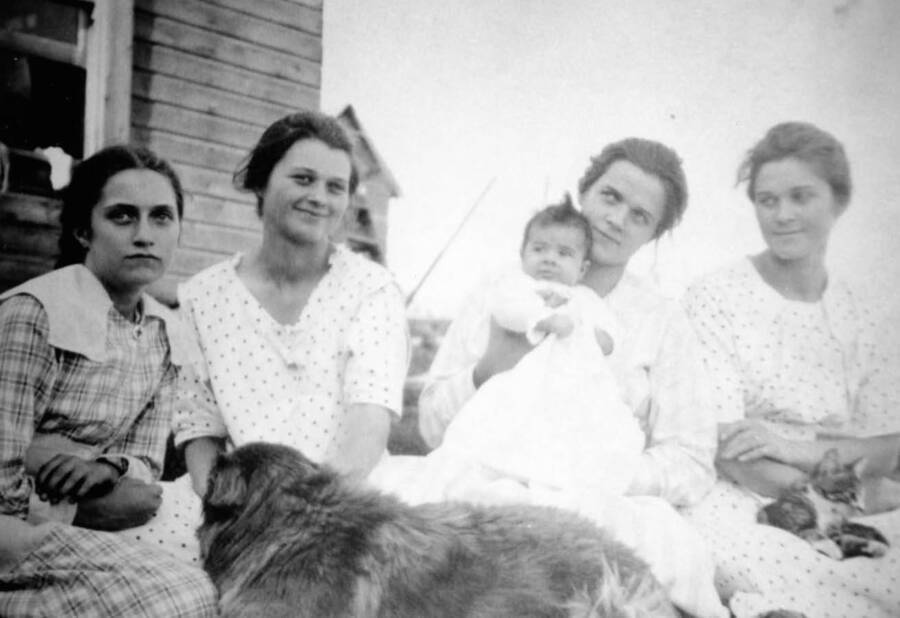 Photograph of Clara Nirk, Ida, Mom holding Cleora Anna, and Emma