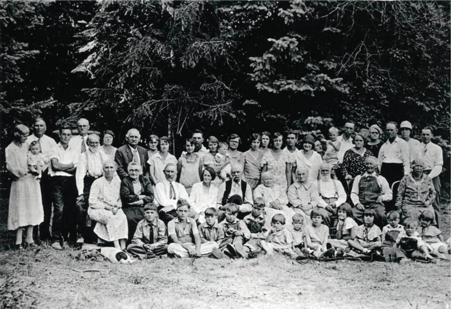 Picture taken on Charley Byseggers place when all the families were home to visit one summer. Left to right back row: Mrs. Halenbeck holding grandson John Jr. Bysegger, John Bysegger, Curtis Katzenberger, Charles Bysegger, Rose Bysegger, John Nirk, Emma  (Bysegger) Davis, Clara (Bysegger) Brandt, Cleora Nirk, Durell Nirk, Ida Soncarty holding baby son Norman, Mary Nirk, Elsie Kazenberger, ?, Louise Katzenberger, Russell Strong, Lois Bysegger, Beth Adams holdin gson Babbie, Ernie Arrasmith, Mamie Beuchamp, Lois Arrasmith, Arthur Strong, Alice Strong, Edward Bysegger. Middle Row seated: Lettie Strong, Bertha Nirk, J. V. Katzenberger, Myra Katzenberger, Ralph Strong, Jane Strong, Anna Bysegger, Fred Bysegger, Rudolph Zimmerman and Lizzie Zimmerman. Seated on ground front row: Gerald Nirk, Eugene Bysegger, Glen Nirk, Lwell Soncarty, Dwight Strong, Velma, Dean, Elezabeth, Isla Bysegger, Leala Nirk, Max Davis, Lyle Strong, Norma Jean Nirk.