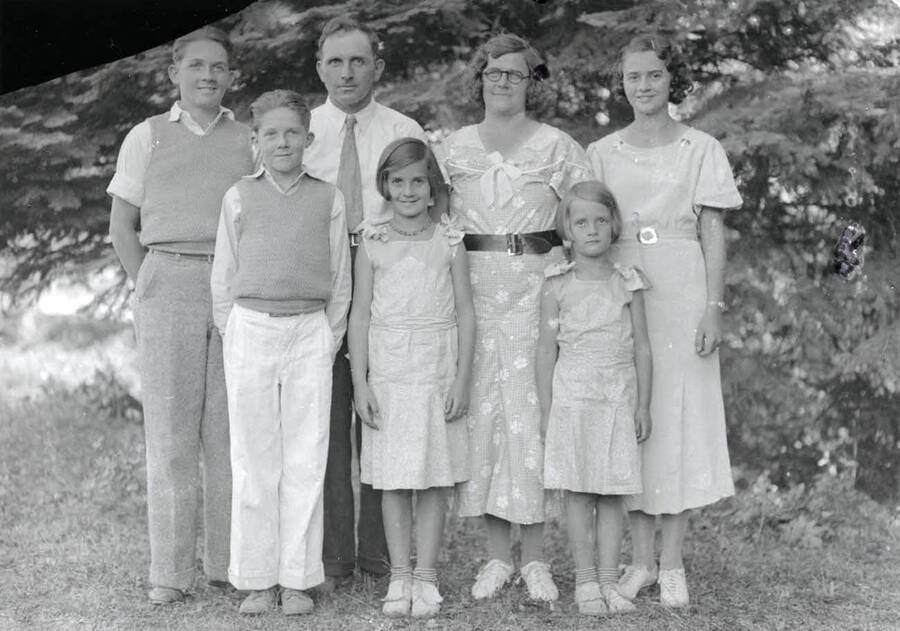 A casual portrait of the Nirk family. Front Row: Glen, Leala and Norma Jean Nirk. Back row: Gerald, Durell, Mary, Cleora Nirk.