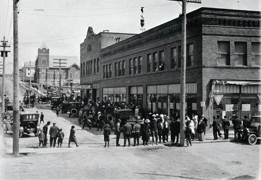 A view down 6th street. Potlatch Mercantile Store can be seen to the right front of the photograph, and the Lutheran Church next, with the old high school at the top right.