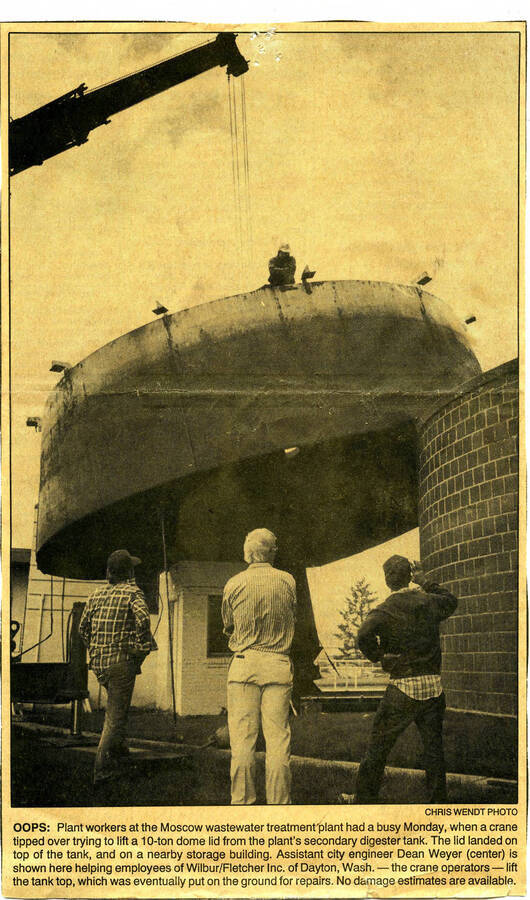 Newspaper clipping, photo with caption: ""Plant workers at the Moscow wastewater treatment plant had a busy Monday""