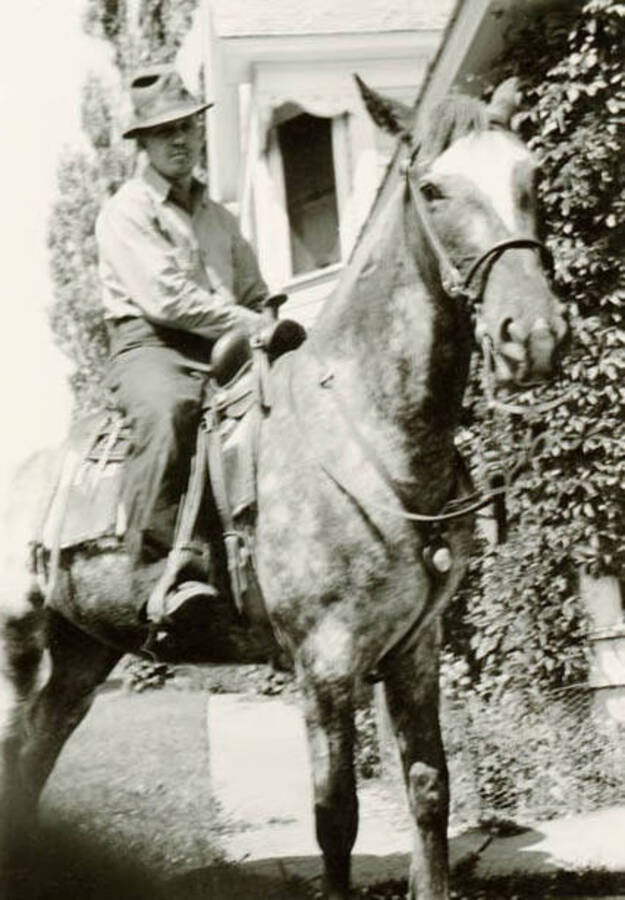 Don Daily sits on horseback outside the Bean home on Yellow Dog Road