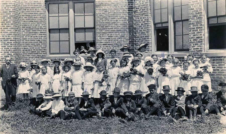 Sunday School class pictured outside of old Union Church that burnt down. Goldie Clyde in the photo.