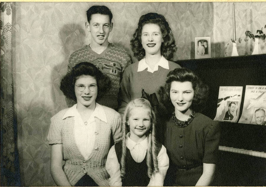 Family photo used for Christmas card. Individuals identified left to right, back to front: Cecil, Doris, Donna, Wilma, Mildred.