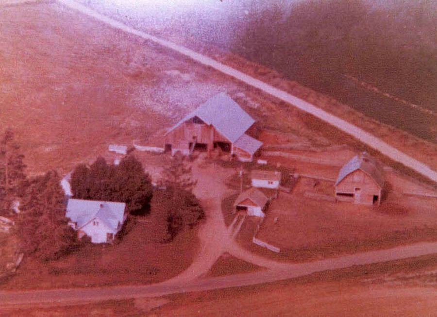 An aerial view of Fred Rohn's farm and barn. The house is in the lower left quadrant of the photograph.