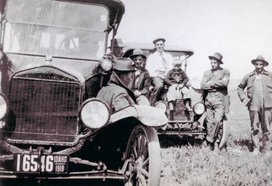 A few men sitting on the hoods of automobiles. Pictured are Mr. Nirk, Bill Leistner, Verne Clark, August Leistnea, Paul Anderson, and Fritz Leistner.