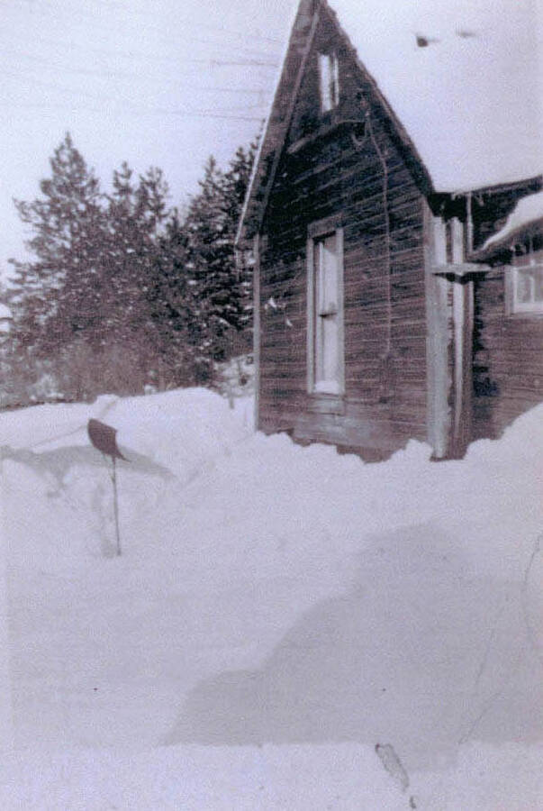 View of Vic Beplate's old house covered in snow.