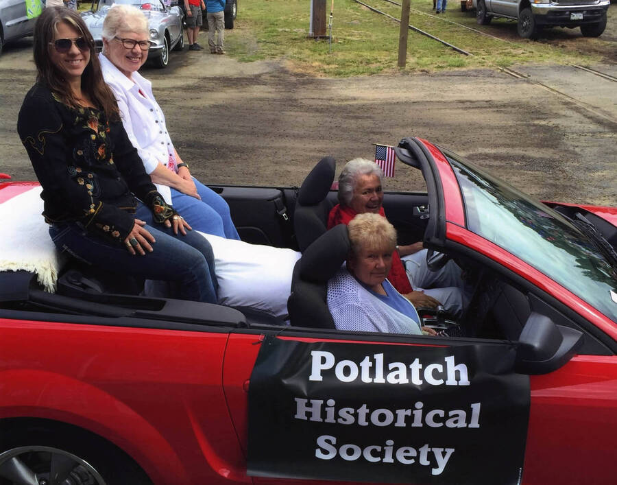 The Grand Marshalls riding in the Potlatch Historical Society car during the Potlatch Days parade in July, 2016. Names read as subjects appear, left to right, front to back: