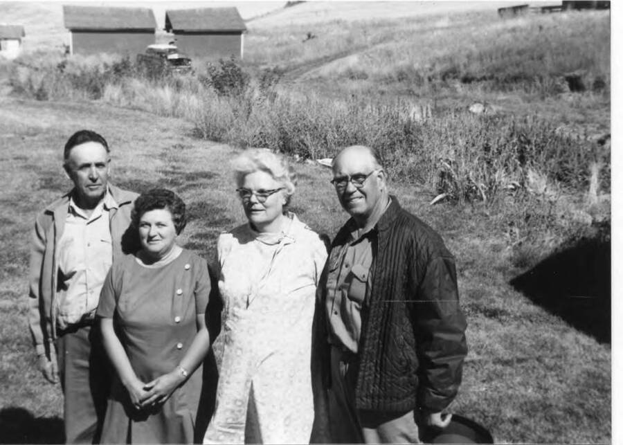 Marion and Bertha Rosenfelt pose for a photo with Alice and Vernon Briney. Marion and Alice were brother and sister. The photo was taken at Fleener farm, located on Estes Road in Moscow, Idaho.
