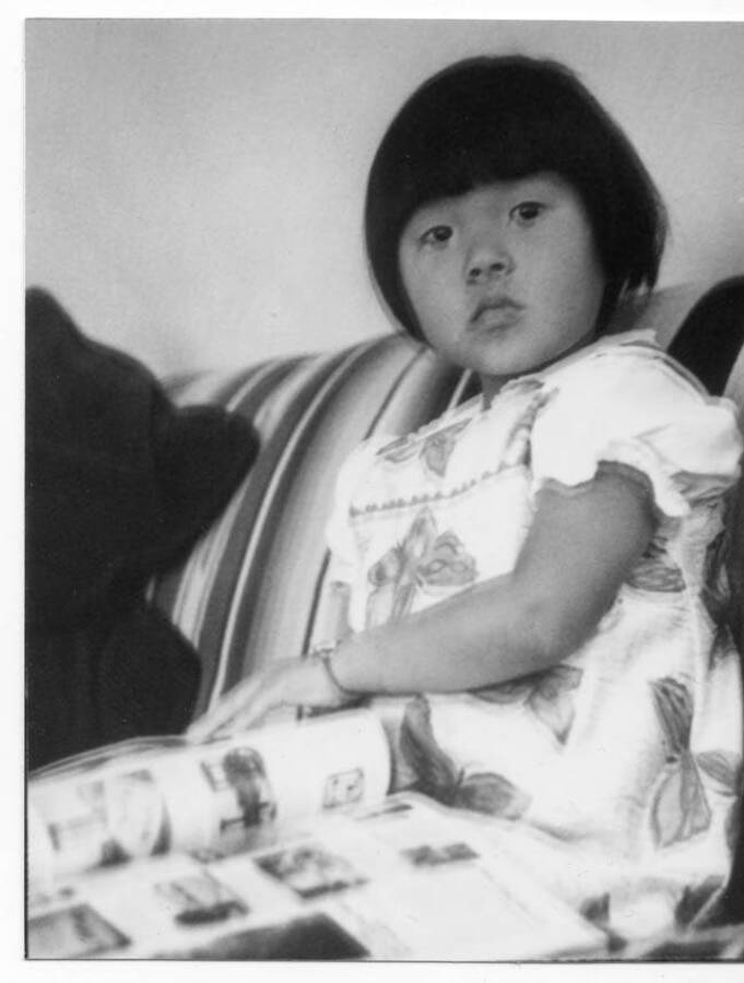 Juanita Kay Fleener in a dress made by Alice Briney. Juanita was adopted by Marva Joyce and Loyal Ivan Fleener from Korea via the Holt Adoption Agency.