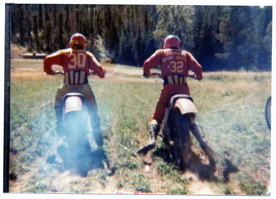 Tim Fleener and possibly Stanley Hawley racking bikes at the Clarkia Fossil Bowl.