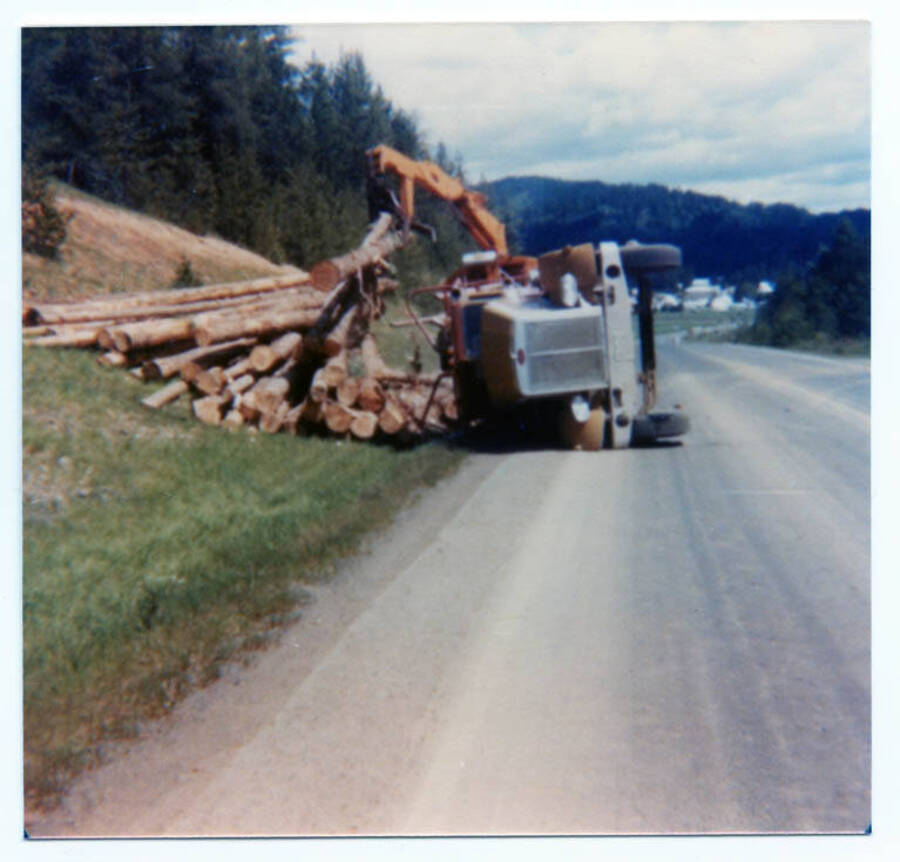Tim Fleener tipped his logging truck over. Fleener family Droutt loader helping to right truck.