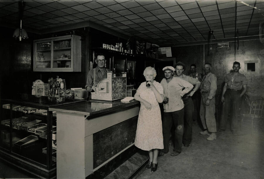 Inside of a bar in Onaway. Left to right: Otis Muck, Henrietta Lewis (managed and ran bar with her son), Elmer Dixon(Hixon?), Edward Denison, Edwin Chambers, and Charley Chambers