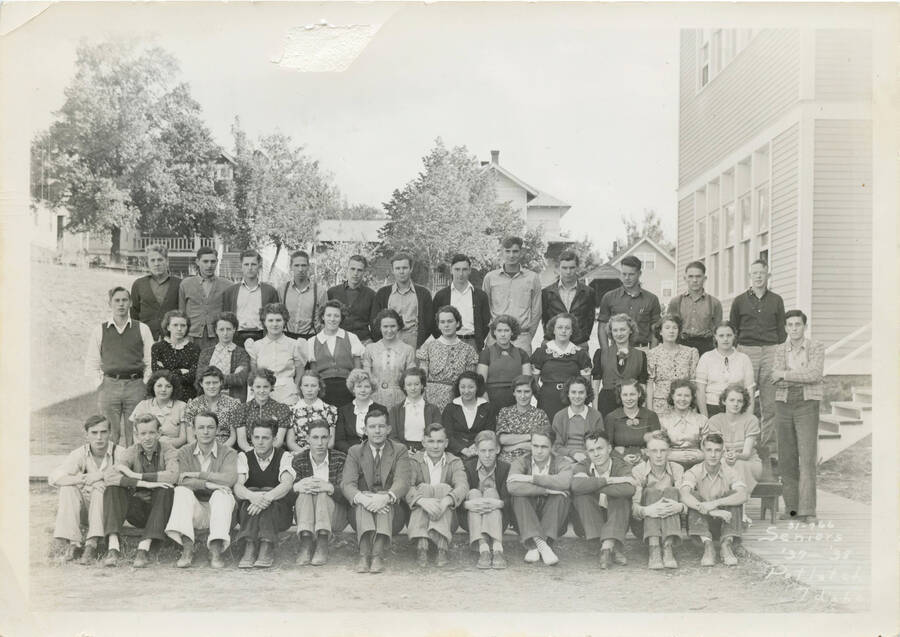 Photo of the Potlatch High School class of 1938, in front of school.