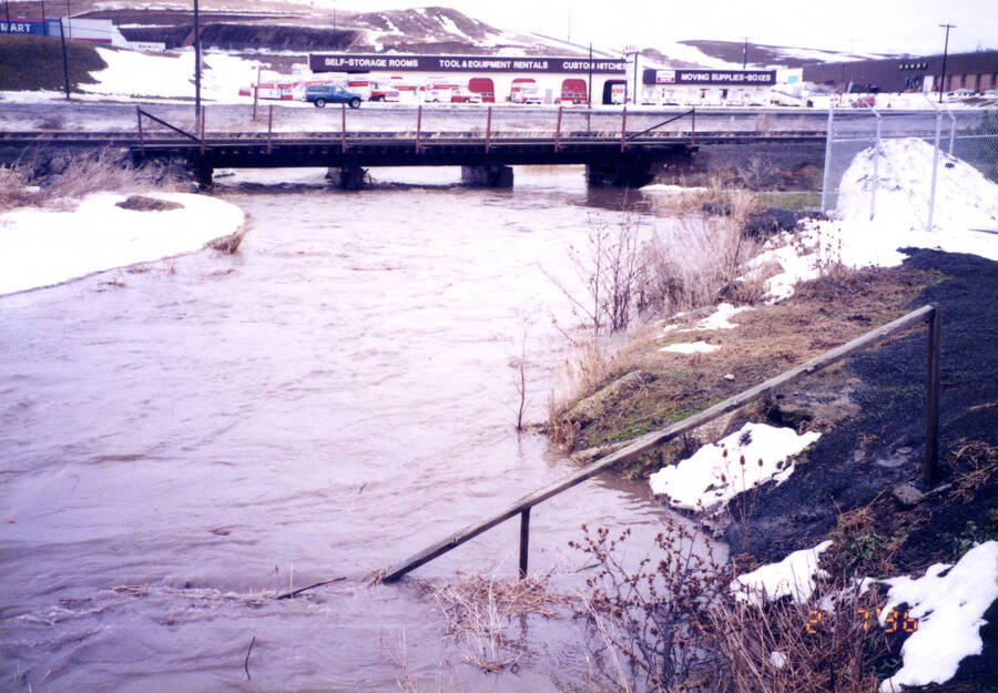 50 year flood February 7, 1996, looking North to railroad bridge from Plant effluent pipes to Paradise Creek
