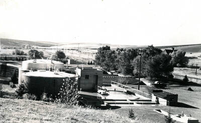 Pre 1943 Primary Digester Front, Secondary Digester in the rear, with Floating Dome elevated with Methane gas.