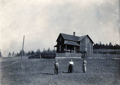 Emaa Bysegger with her mother and father on homestead