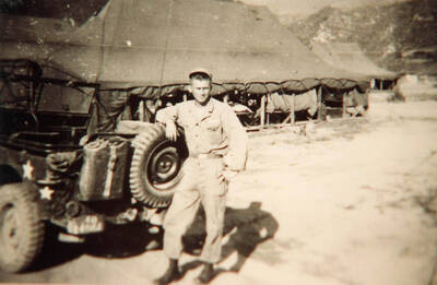 Norman while in Korea, maybe in front of MASH.