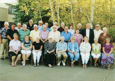 Group photo of reunion celebration. Front row, Shultz, Sharon; Doty, JoAnn; Doty, Barbara; Largent, Connie; Coble, Kieth; Keiser, Caroline; Vandermark, Sharon; Swanson, Beatrice; Besst, Joy. 2nd row, French, Darrel; Kellmer, Roger; Gilliam, Ray; Morrison, David; McBride, Ed; Spangler, Jim; Pelton, Sally; Rohn, Bonnie. 3rd row, Gotschalk, Dale; Harris, Dave; Rohn, Joe; Allen, Jim; Bain, Delbert; Krough, Ray; Roberts, Jerry; Olson, Judy; Capellan, Jim; Knott, Denny; Figgins, Willy.