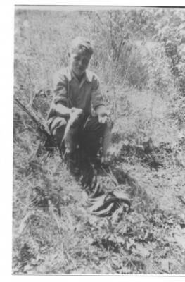 Loyal Ivan Fleener holding fish that he caught.