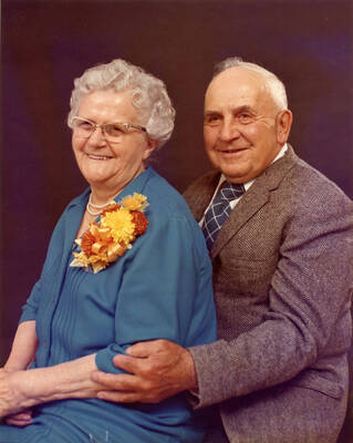 Photo of Durell and Mary Nirk. Merry Christmas to Larry Charles from Mom and Pop. August 1974.