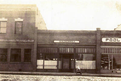 The Golden Rule Drugstore next door to pool hall.
