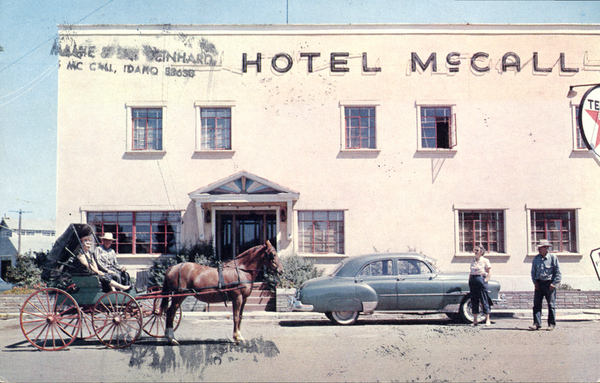 Original postcard with a photo on the front of Hotel McCall with a tourist horse and buggy, a couple nest to a car. On the back there is printed text, “ Deinhard’s Hotel McCall: Located on beautiful Payette Lakes in the mile high country of Idaho. Proprietors, Mr & Mrs. William Deinhard, McCall, Idaho”. Image contains the text: "HOTEL McCALL MC CALL, IDAHO"