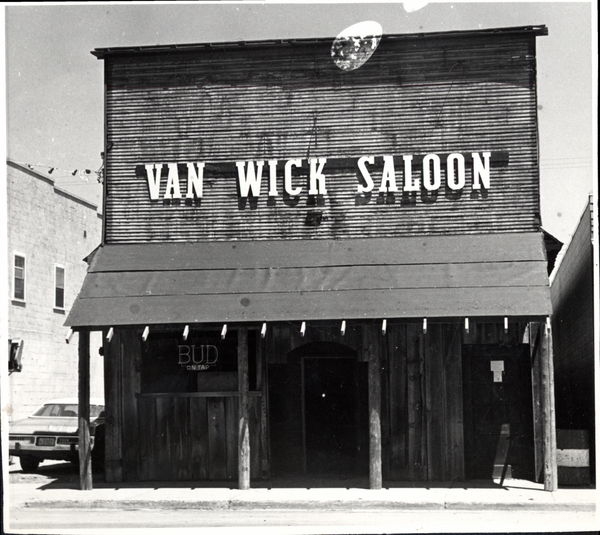 Van Wick Saloon building. Image contains the text: "VAN WICK SALOON BUD ON TAP"