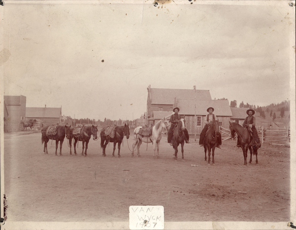 Three riders and pack string. Image contains the text: "VAN WYCK 1907"