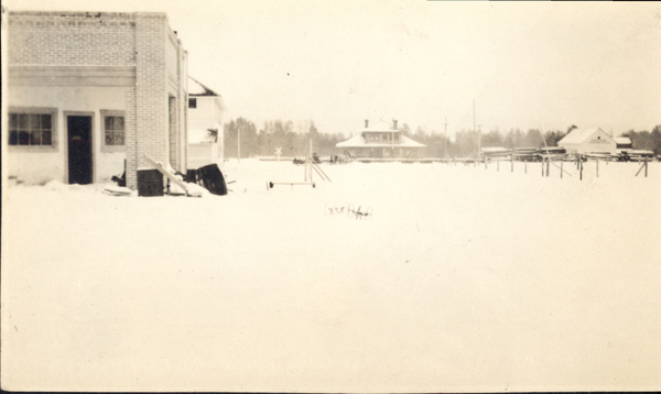 Donnelly- early photo, school in background. G. Wisdom says it’s  Kangas garage, not M and M, as on photo