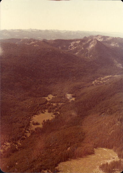 Original colored aerial photograph of meadows and mountains