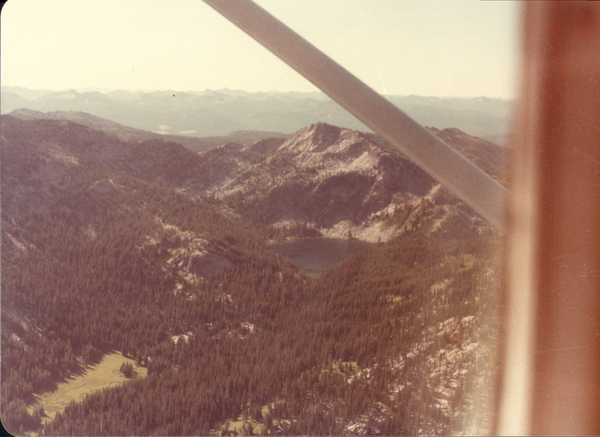 Original colored aerial photograph of a lake and mountains