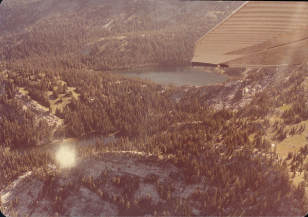 Original colored aerial photograph of two lakes and pines