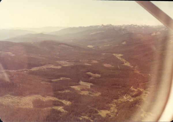 Original colored aerial photograph of meadows and mountains