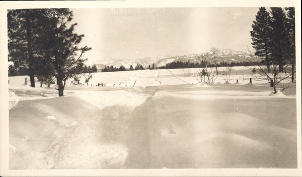 “Long Valley” with snowy fields and mountains