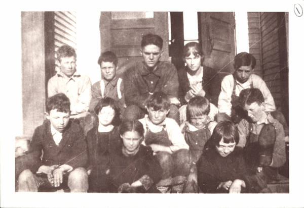 Alpha School Round Valley, Idaho. Back Side, “Left to right. Back row-Ralph Lathrop, Richard Schoonover, teacher- Wendell Ame, Georgie Lathrop, Lloyd Parks. Middle Row-George Smith,  Dorothy Kirby, Frank Parks, Alex Fry, Benton Kirby. Front row- Alice Schoonover, Wilma Allen.”