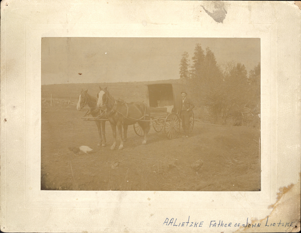 “AA Leitzke, father of John Leitzke” with horse and buggy. Stamped on reverse: “ AA Leitzke, Faith and medical healer of all diseases.”. Image contains the text: "A A Lietzke Father of John Lietzke"