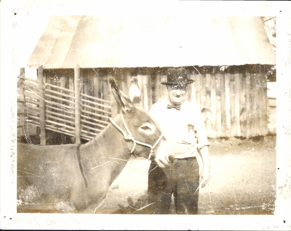 William Deinhard with a donkey