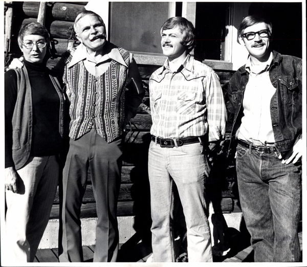 Vic and Pat Durden and Geddes Bros. In front of a building