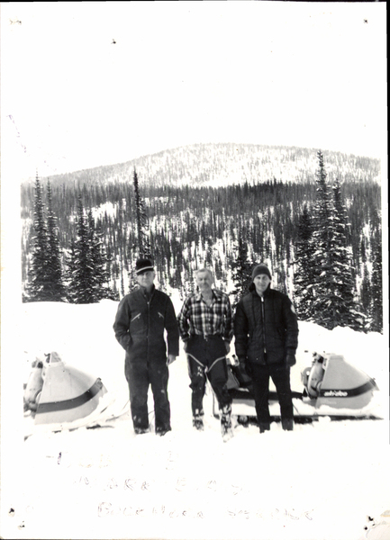 Photograph of Bob Mc.B., Mark Evans, Buckhorn Herrick with snowmobiles